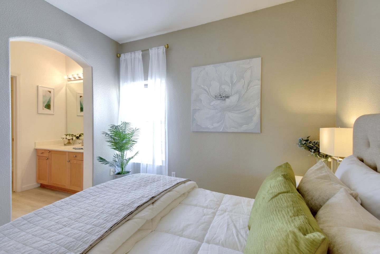 842 Wind Walk Milpitas, CA 95035 - Photo 18 of 45 a bed room with a bed and a cabinets