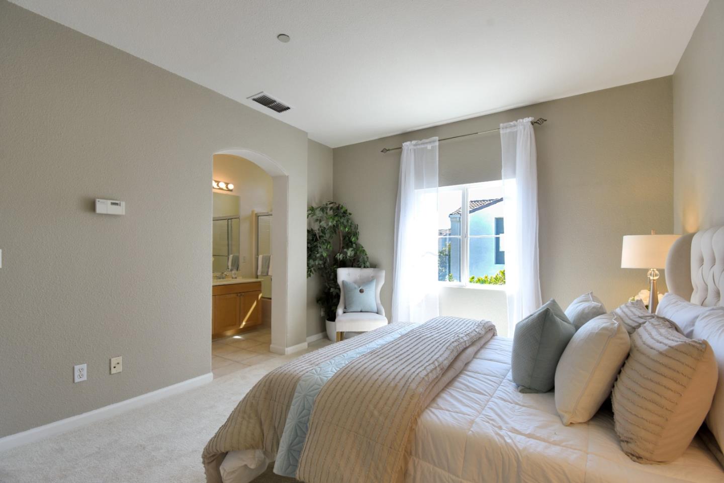 842 Wind Walk Milpitas, CA 95035 - Photo 21 of 45 a bedroom with a bed and a potted plant