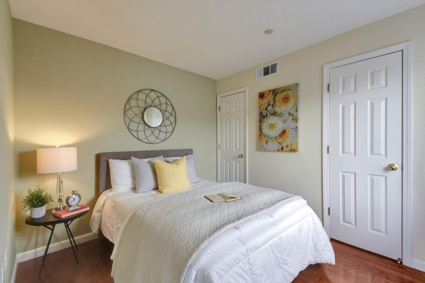 842 Wind Walk Milpitas, CA 95035 - Photo 23 of 45 a bedroom with a bed and wooden floor