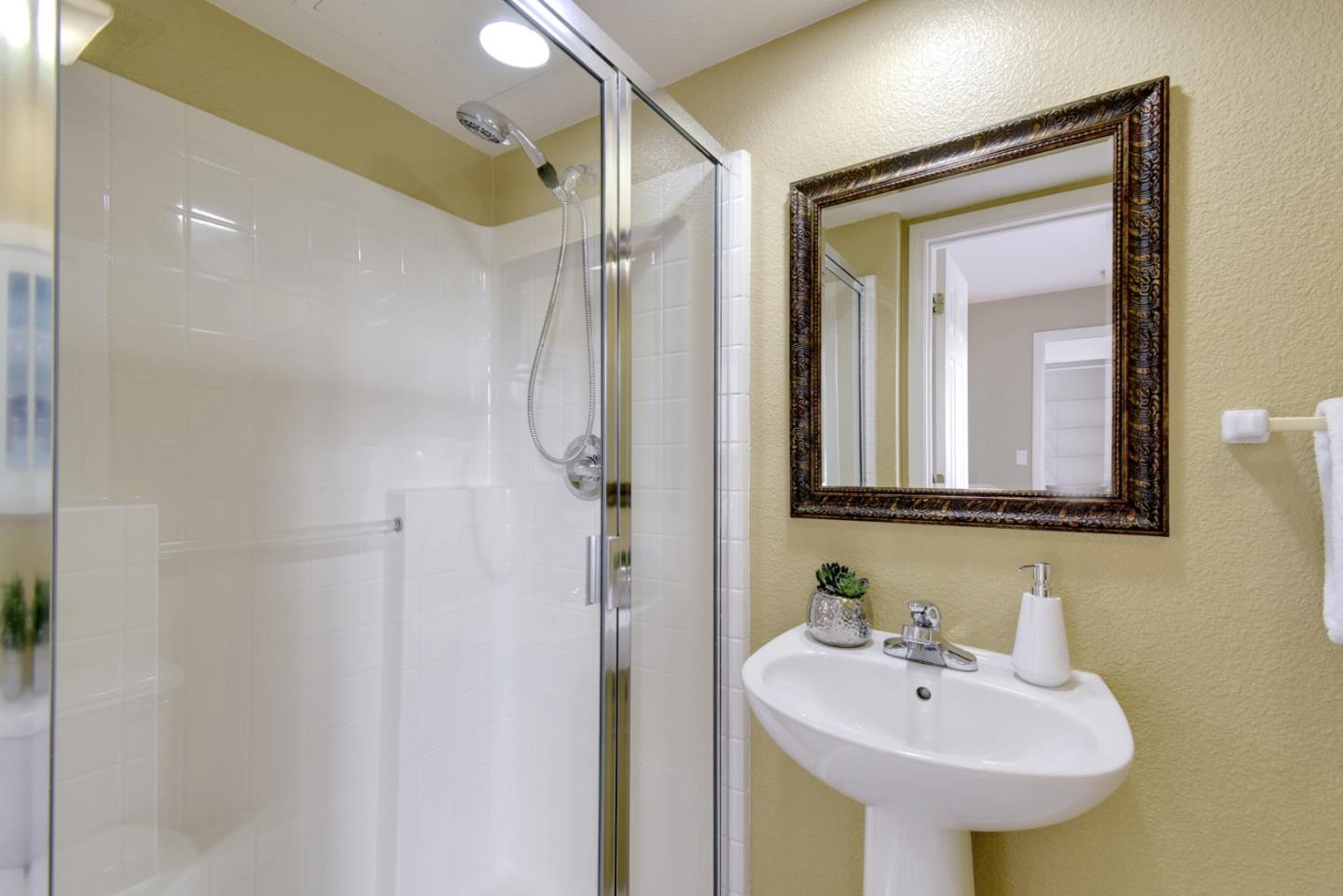 842 Wind Walk Milpitas, CA 95035 - Photo 29 of 45 a bathroom with a sink and a mirror