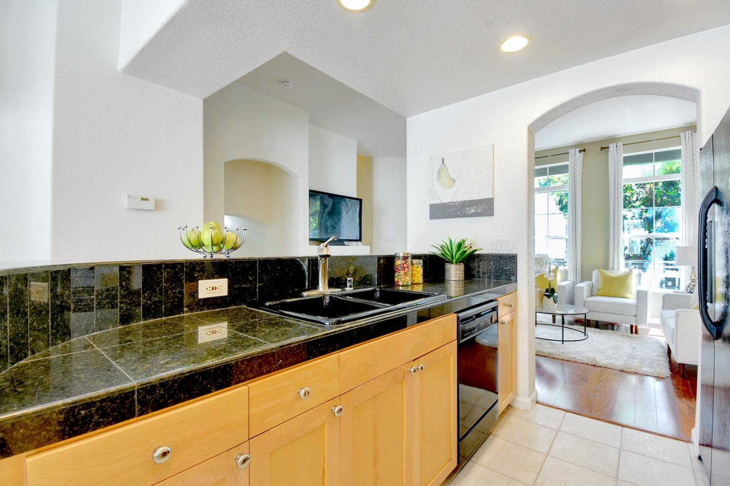 842 Wind Walk Milpitas, CA 95035 - Photo 9 of 45 a kitchen with stainless steel appliances a sink counter top space and living room view