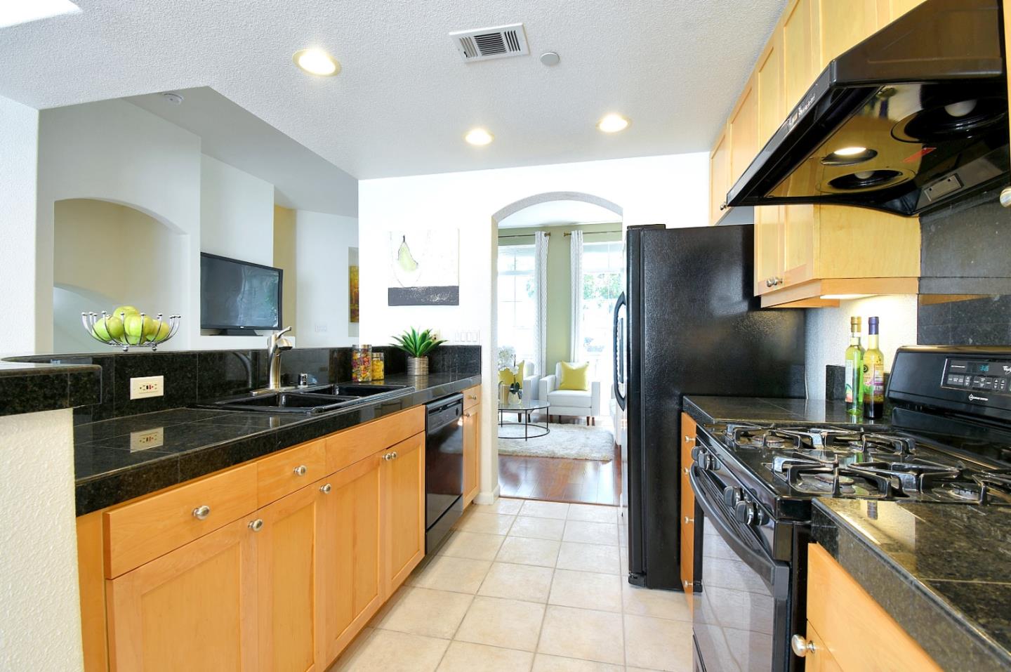 842 Wind Walk Milpitas, CA 95035 - Photo 10 of 45 a kitchen with stainless steel appliances granite countertop a stove a sink and a refrigerator