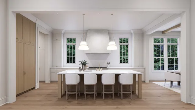 a kitchen with a dining table chairs and sink