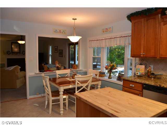 13802 Turtle Hill Road Midlothian, VA 23112 - Photo 3 of 12 a view of a dining room with furniture and chandelier