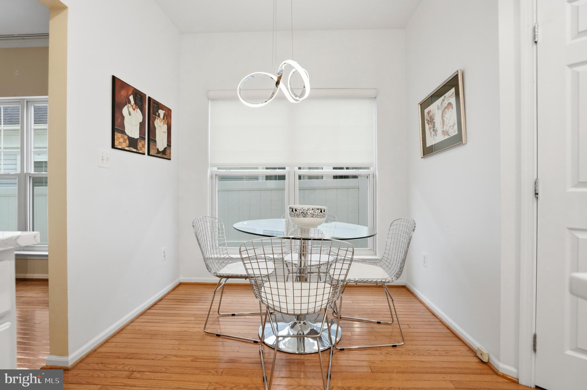 8941 Griffin Way, Unit 8941 Baltimore, MD 21208 - Photo 14 of 49 a view of a livingroom with furniture and wooden floor