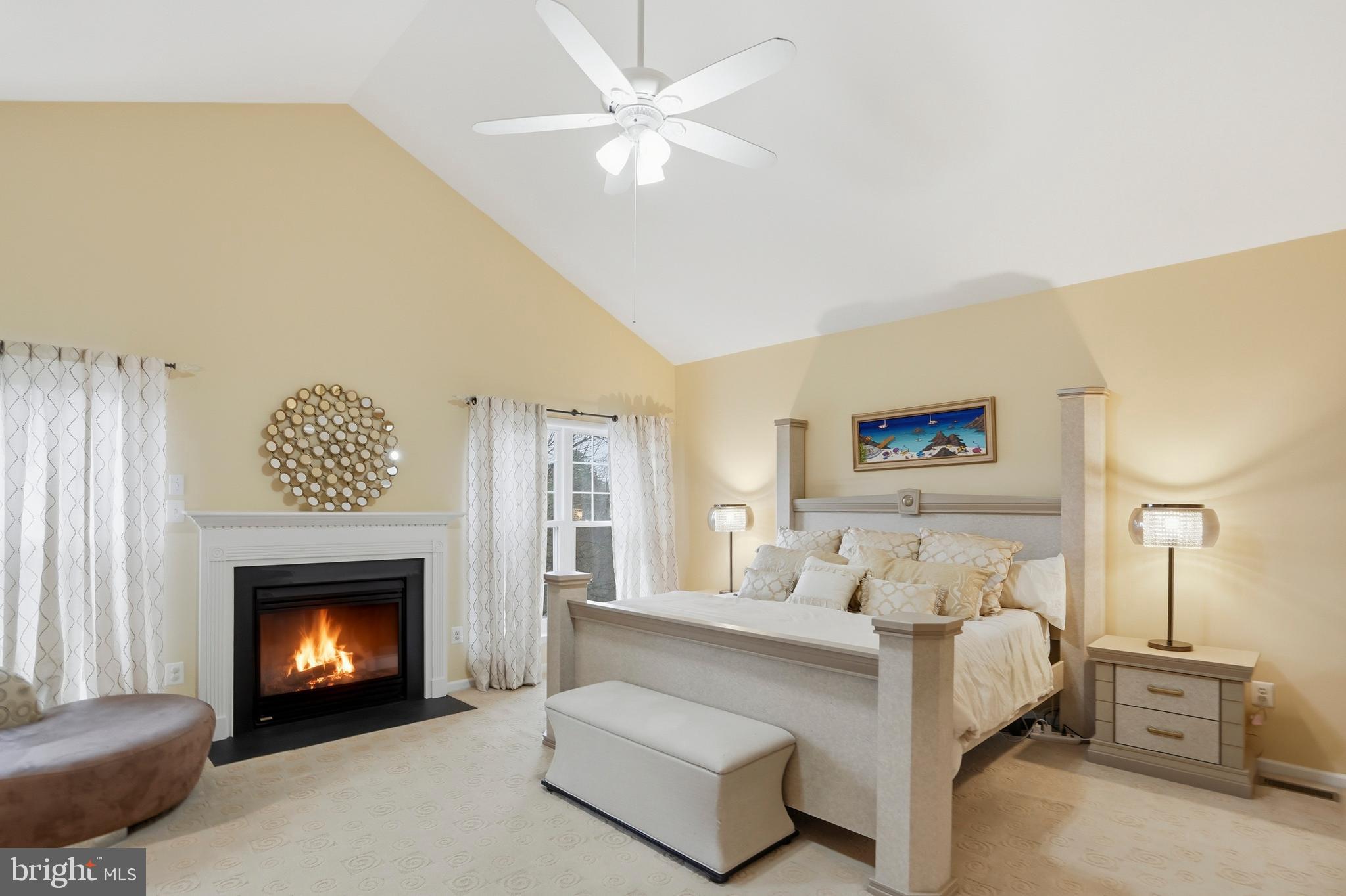 8941 Griffin Way, Unit 8941 Baltimore, MD 21208 - Photo 16 of 49 a bedroom with a bed and a fireplace