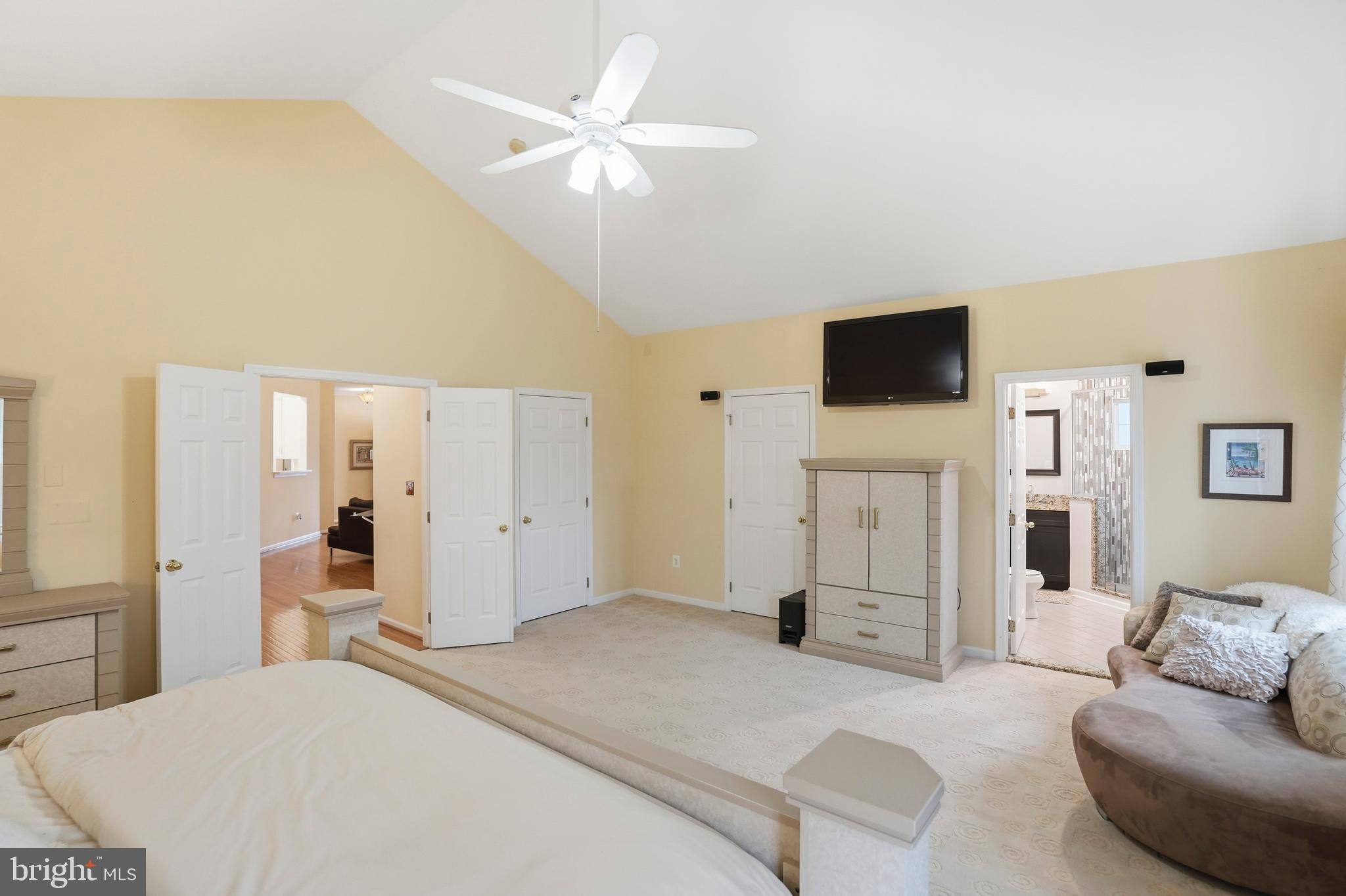 8941 Griffin Way, Unit 8941 Baltimore, MD 21208 - Photo 18 of 49 a spacious bedroom with a bed and a flat screen tv