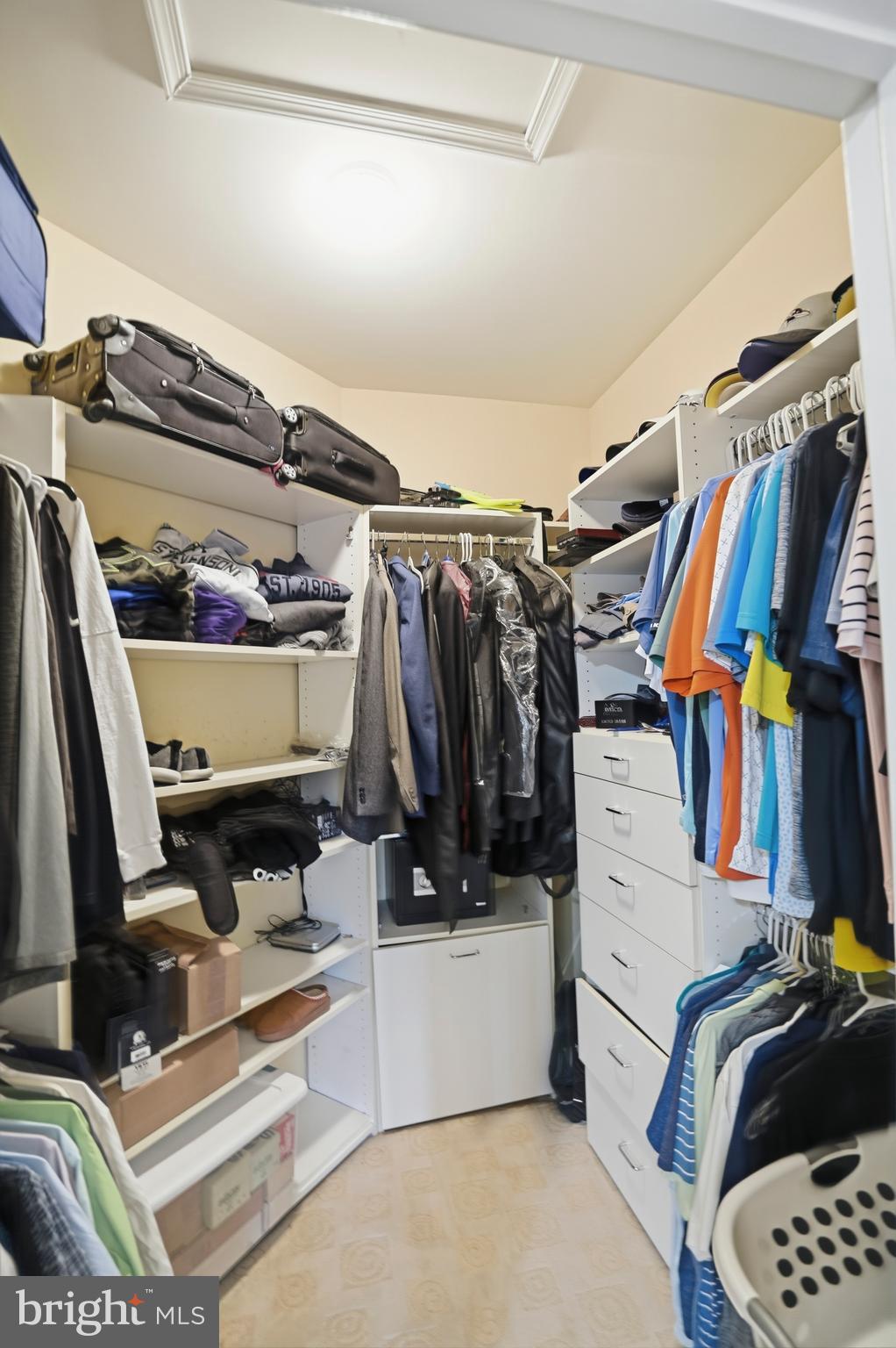 8941 Griffin Way, Unit 8941 Baltimore, MD 21208 - Photo 19 of 49 a view of walk in closet with clothes and shoes