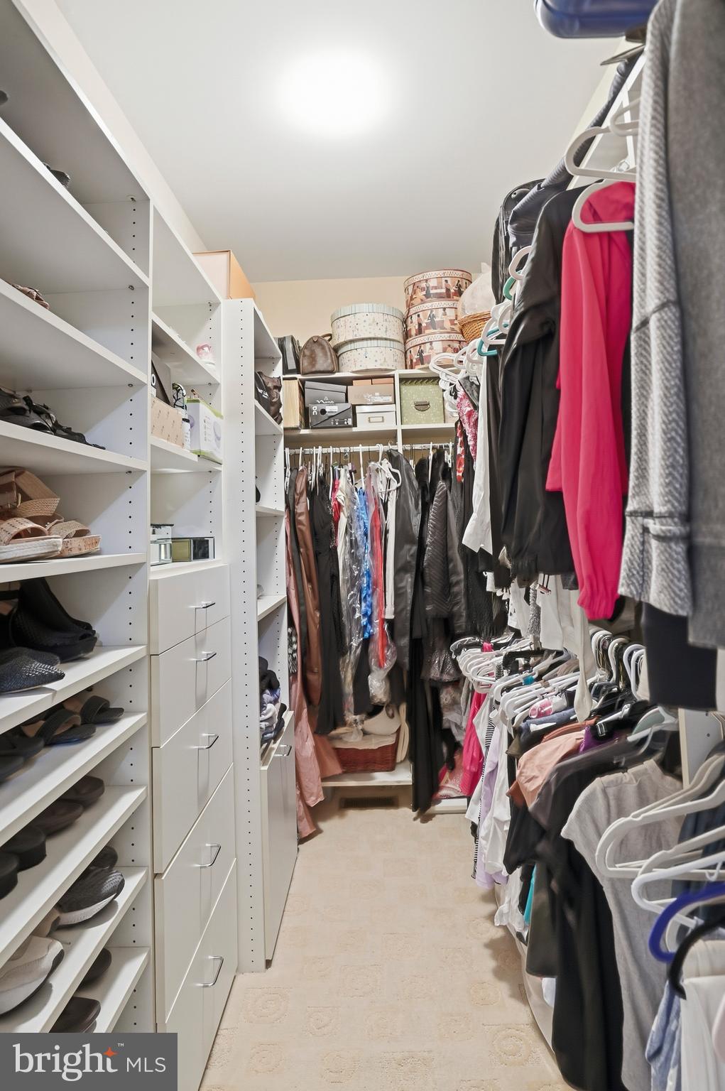 8941 Griffin Way, Unit 8941 Baltimore, MD 21208 - Photo 20 of 49 a view of walk in closet with clothes