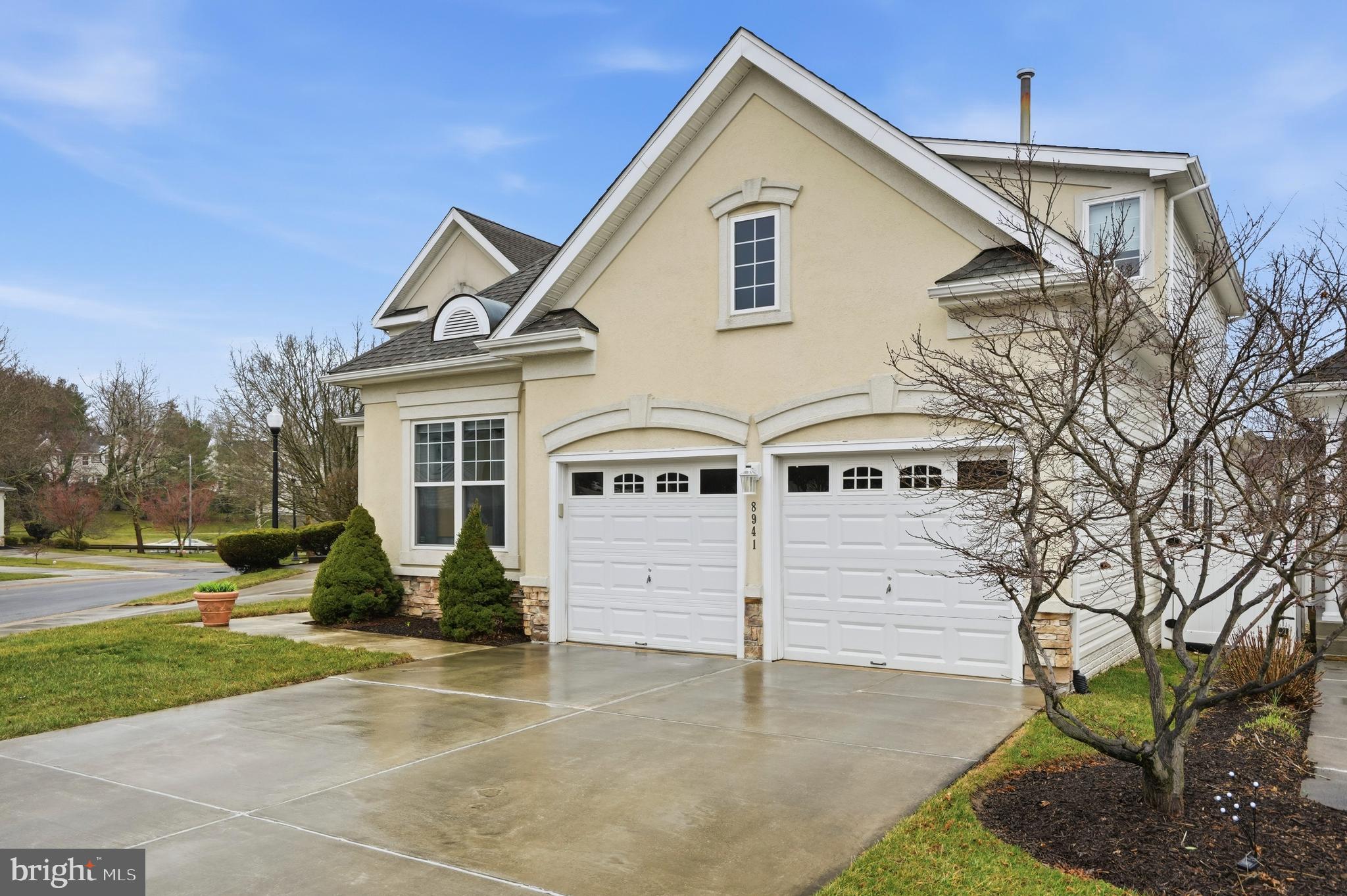 8941 Griffin Way, Unit 8941 Baltimore, MD 21208 - Photo 2 of 49 a front view of a house with a yard