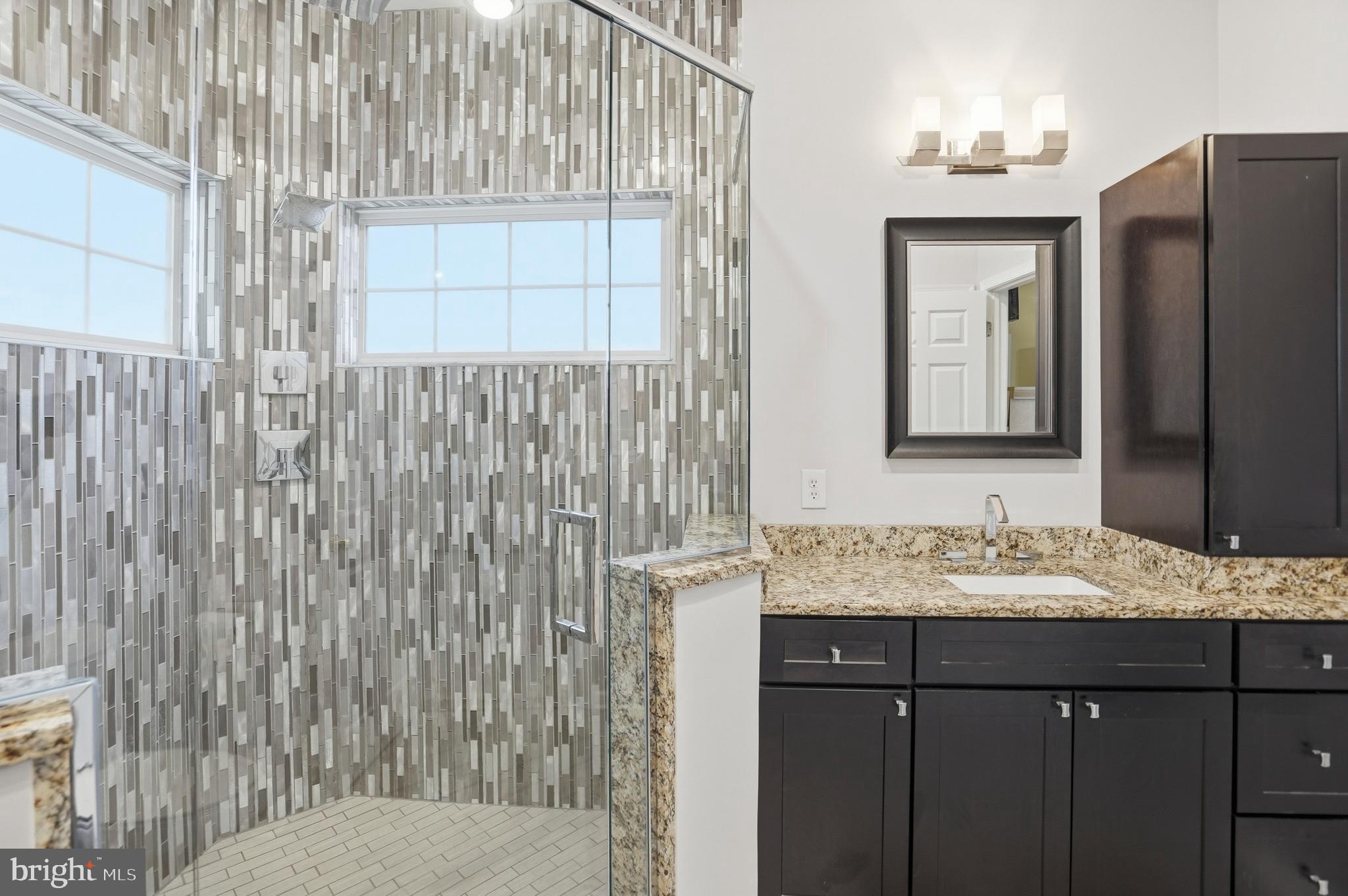 8941 Griffin Way, Unit 8941 Baltimore, MD 21208 - Photo 22 of 49 a bathroom with a sink and a mirror