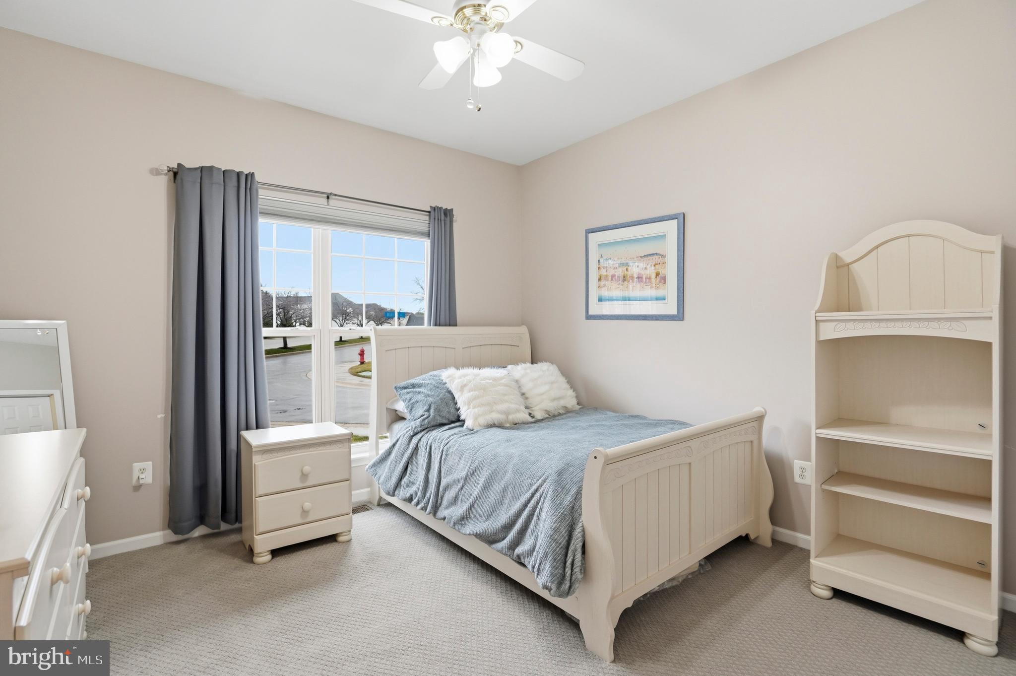 8941 Griffin Way, Unit 8941 Baltimore, MD 21208 - Photo 24 of 49 a bedroom with a bed and a chandelier