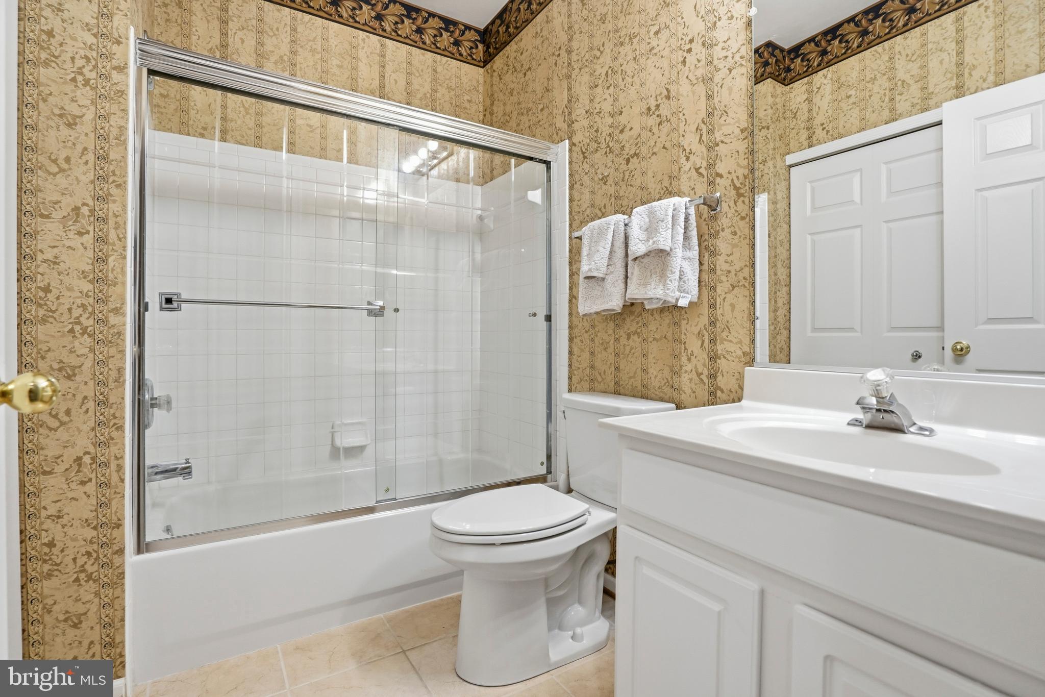 8941 Griffin Way, Unit 8941 Baltimore, MD 21208 - Photo 26 of 49 a bathroom with a sink a toilet and shower
