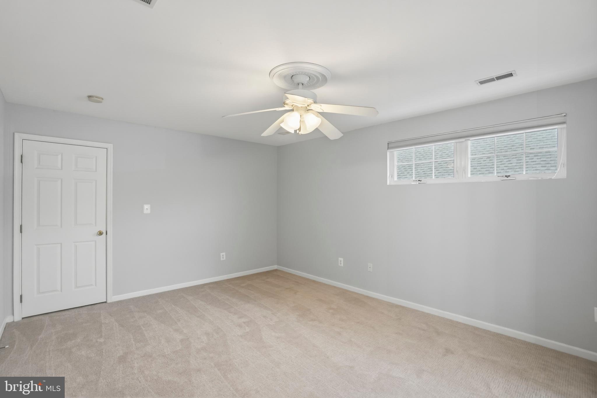 8941 Griffin Way, Unit 8941 Baltimore, MD 21208 - Photo 27 of 49 a window in an empty room