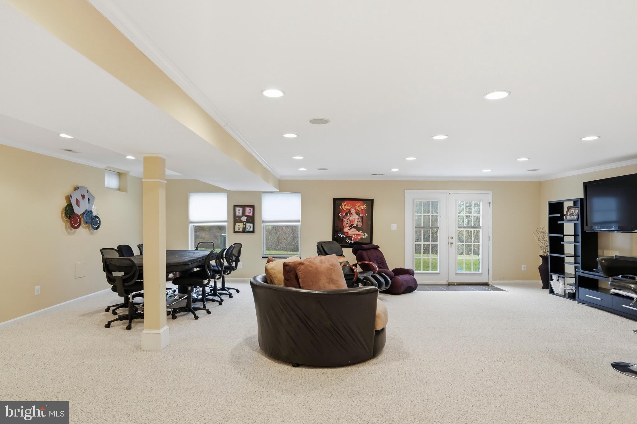 8941 Griffin Way, Unit 8941 Baltimore, MD 21208 - Photo 32 of 49 a living room with furniture and a flat screen tv