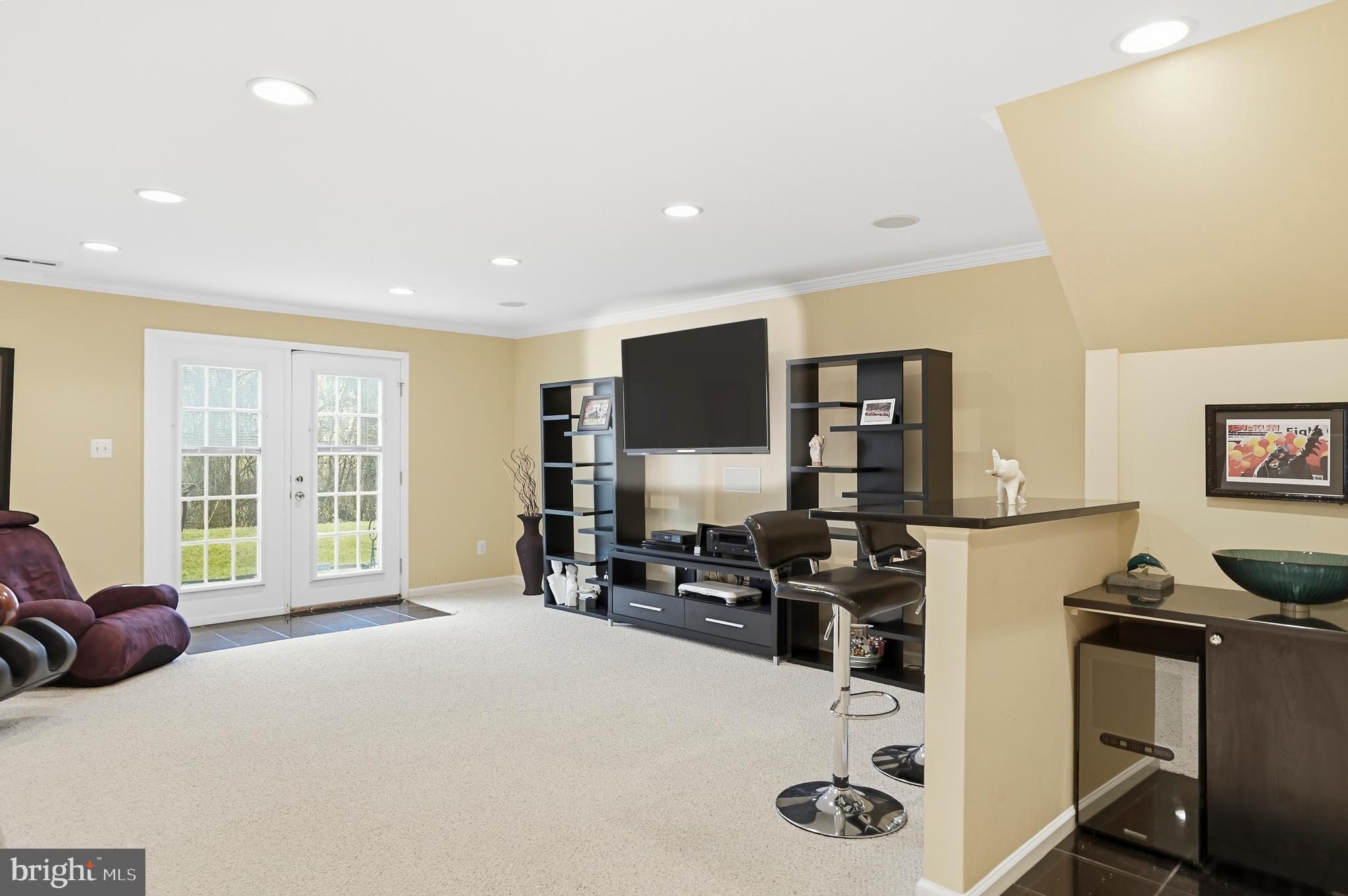 8941 Griffin Way, Unit 8941 Baltimore, MD 21208 - Photo 33 of 49 a bedroom with furniture and large windows