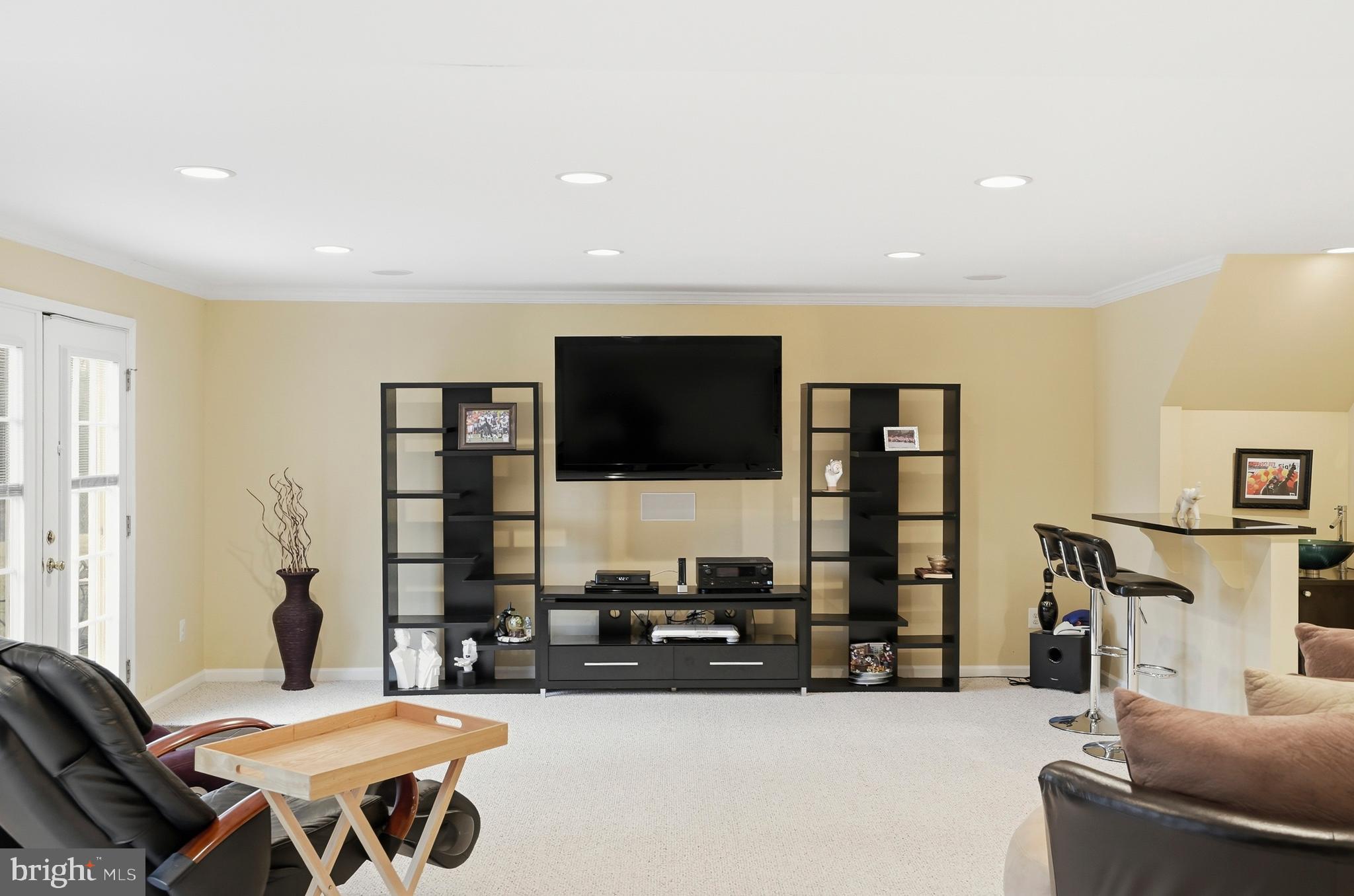 8941 Griffin Way, Unit 8941 Baltimore, MD 21208 - Photo 34 of 49 a living room with furniture and a flat screen tv