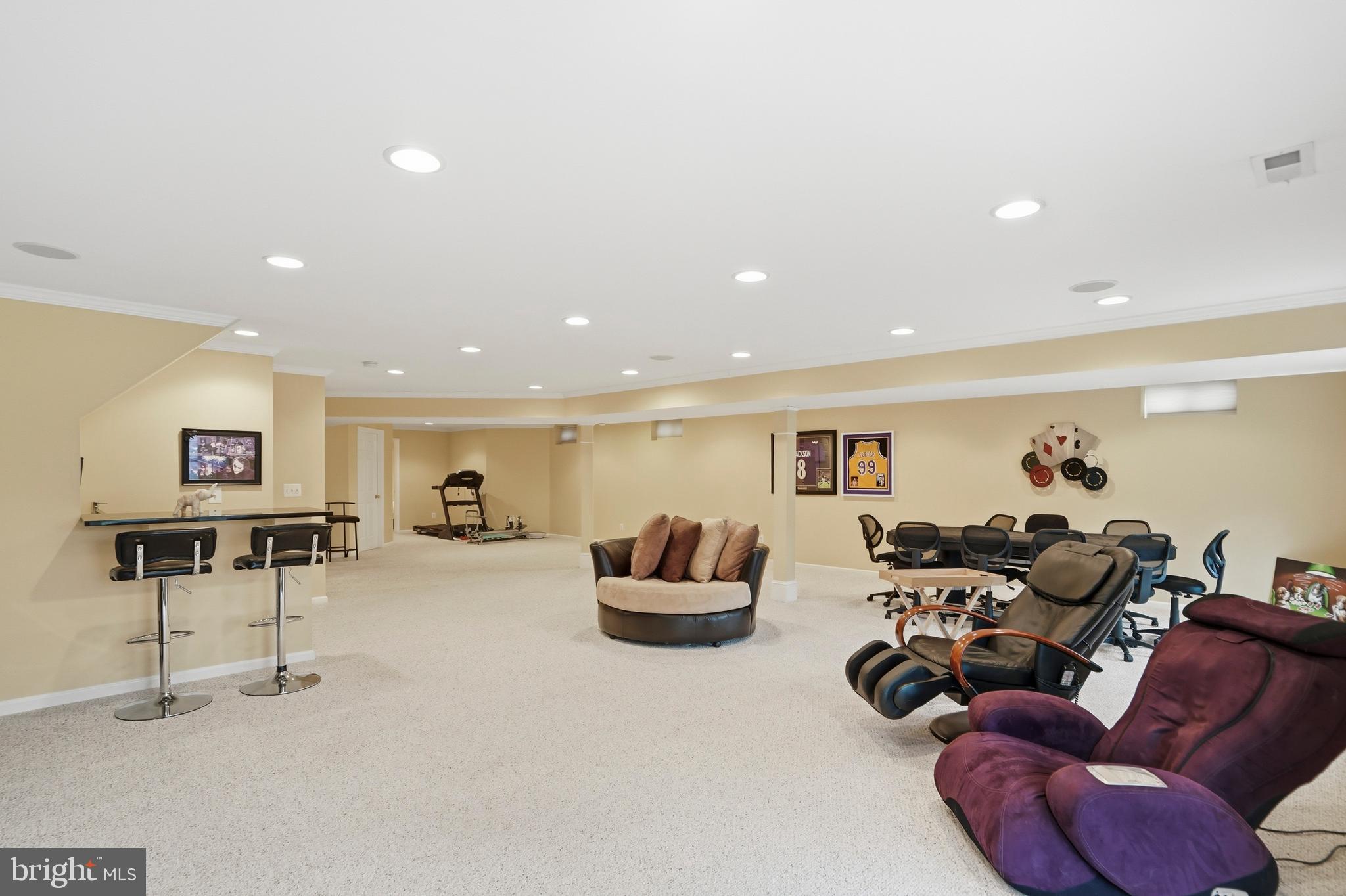 8941 Griffin Way, Unit 8941 Baltimore, MD 21208 - Photo 35 of 49 a living room with furniture and a flat screen tv