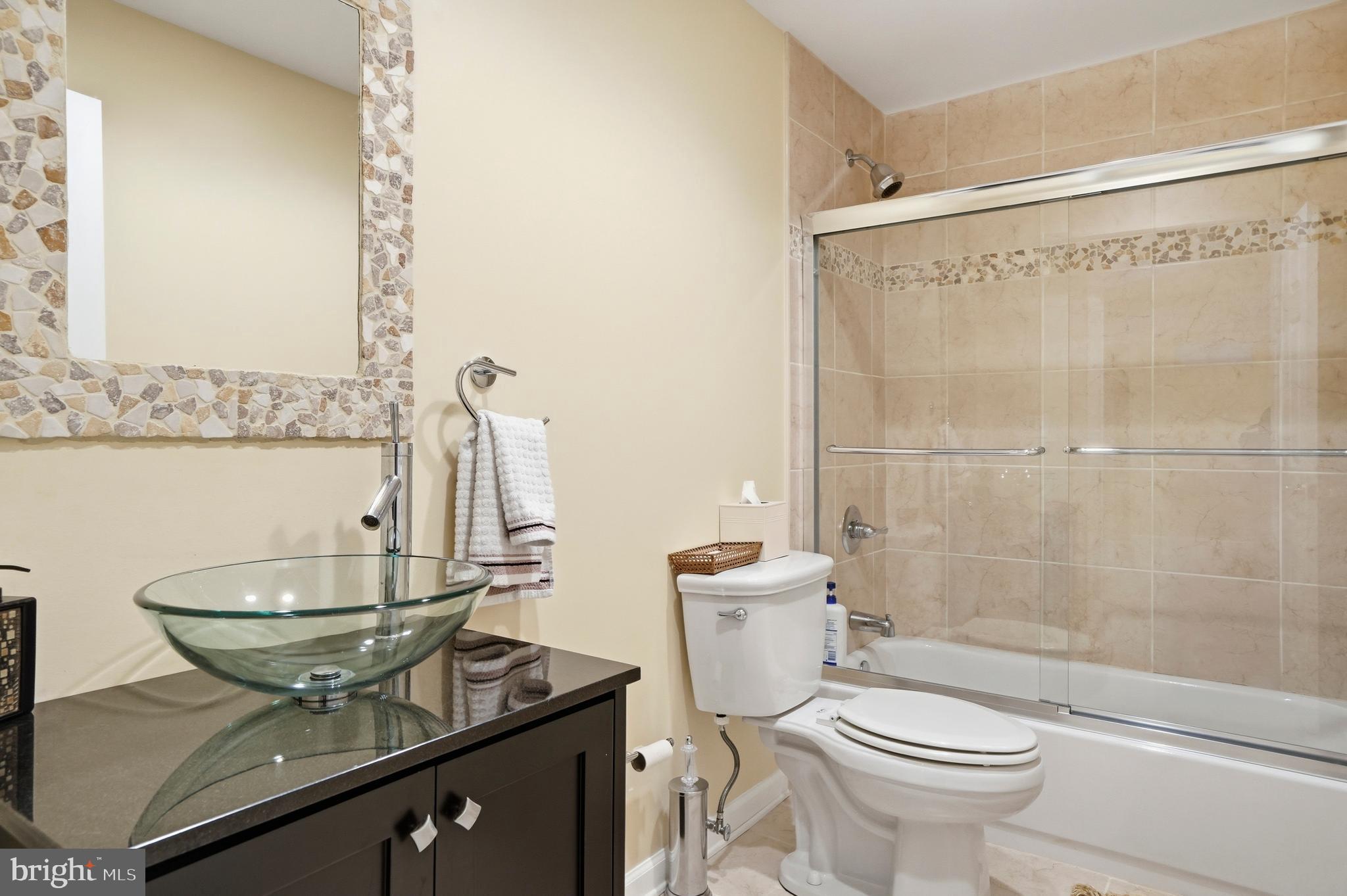 8941 Griffin Way, Unit 8941 Baltimore, MD 21208 - Photo 41 of 49 a bathroom with a sink toilet and shower