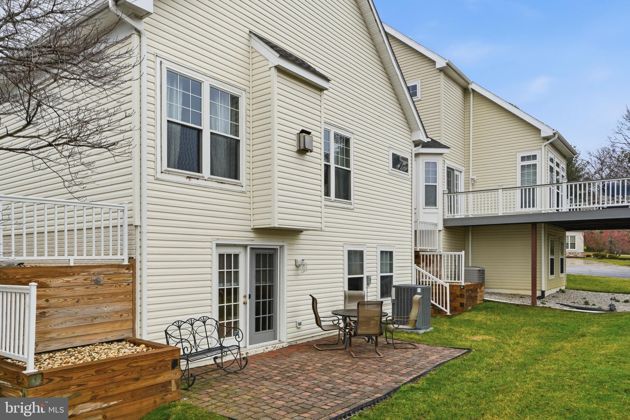 8941 Griffin Way, Unit 8941 Baltimore, MD 21208 - Photo 42 of 49 a view of a white house with a patio