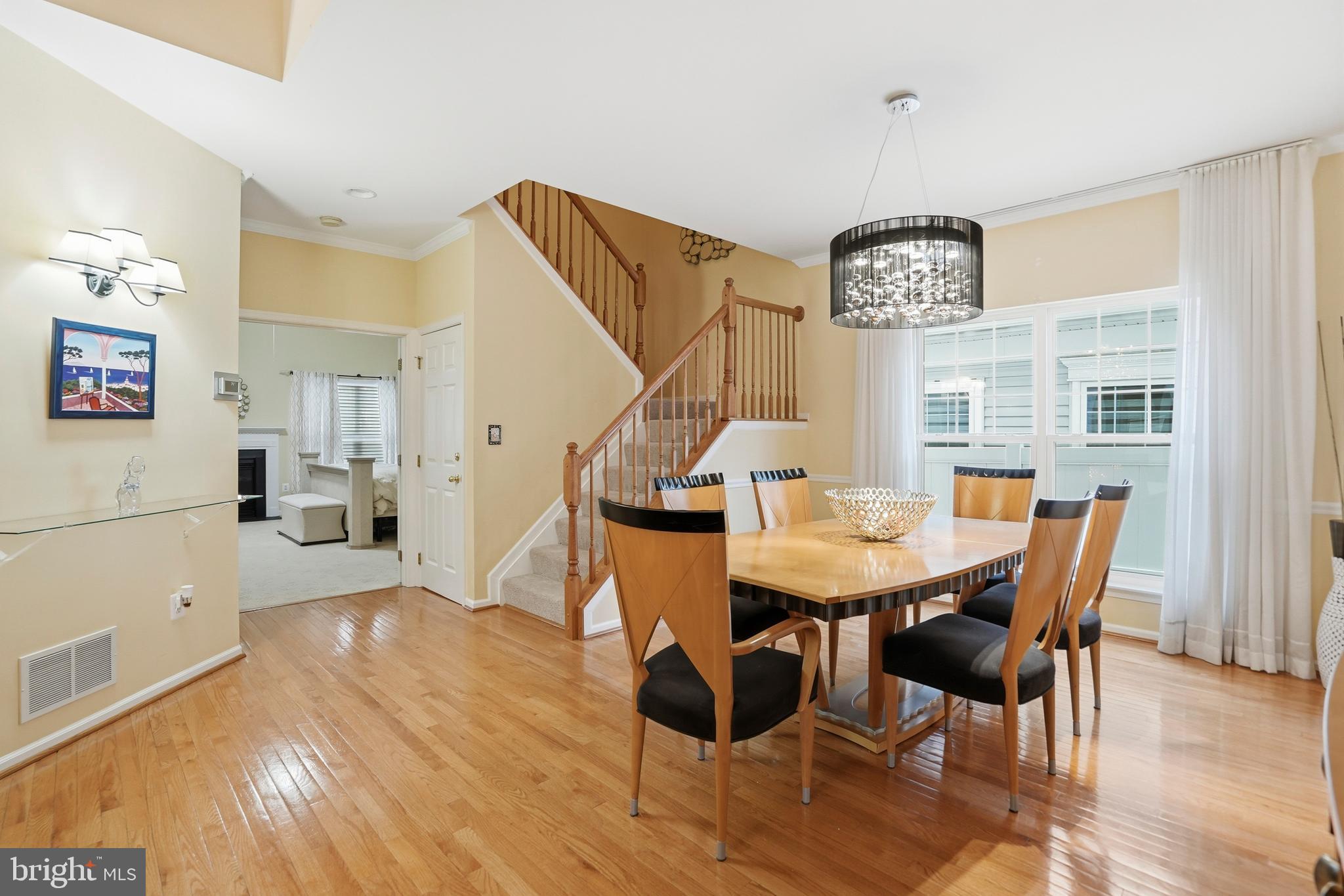 8941 Griffin Way, Unit 8941 Baltimore, MD 21208 - Photo 9 of 49 a view of a dining room with furniture and wooden floor