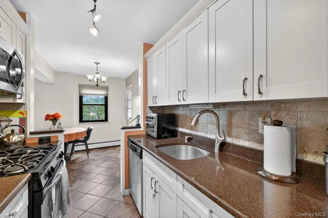 a view of a hallway with seating area