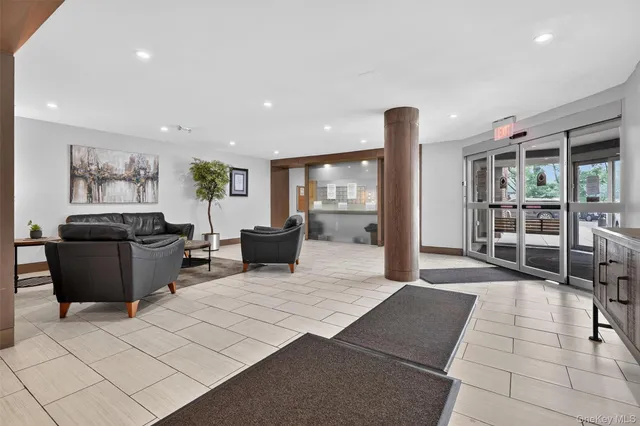 a living room with furniture and a large window