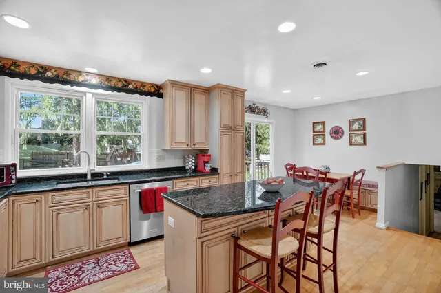 a kitchen with granite countertop lots of counter top space and dining table