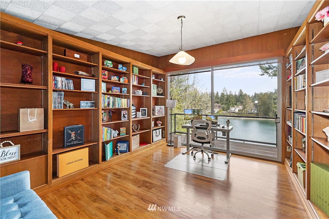 1600 Madrona Point Bremerton, WA 98312 - Photo 13 of 40 a dining room with furniture and a book shelf
