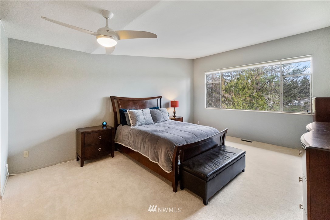 1600 Madrona Point Bremerton, WA 98312 - Photo 18 of 40 a bedroom with a bed lamp and window