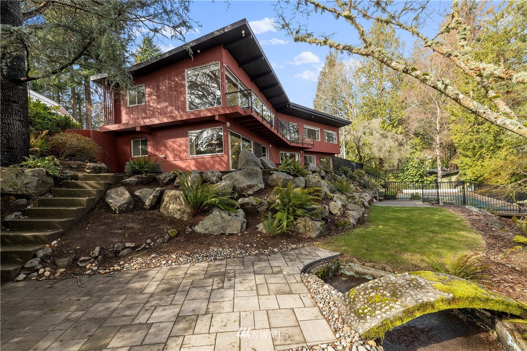 1600 Madrona Point Bremerton, WA 98312 - Photo 19 of 40 a view of a wooden house with a yard