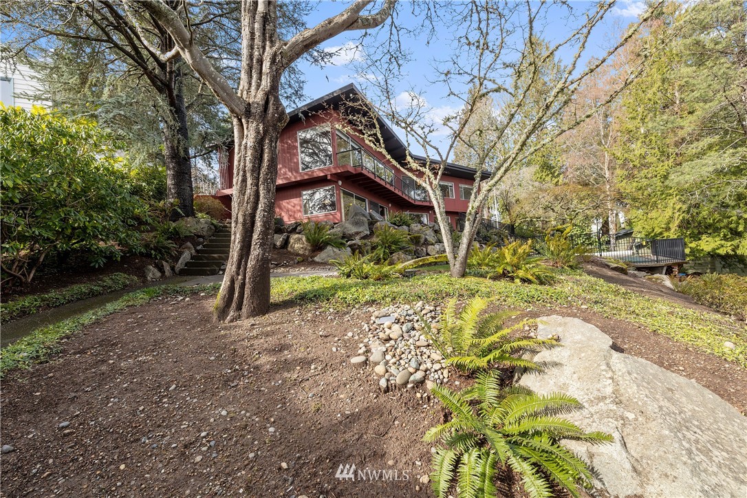 1600 Madrona Point Bremerton, WA 98312 - Photo 2 of 40 a view of a yard with plants and trees