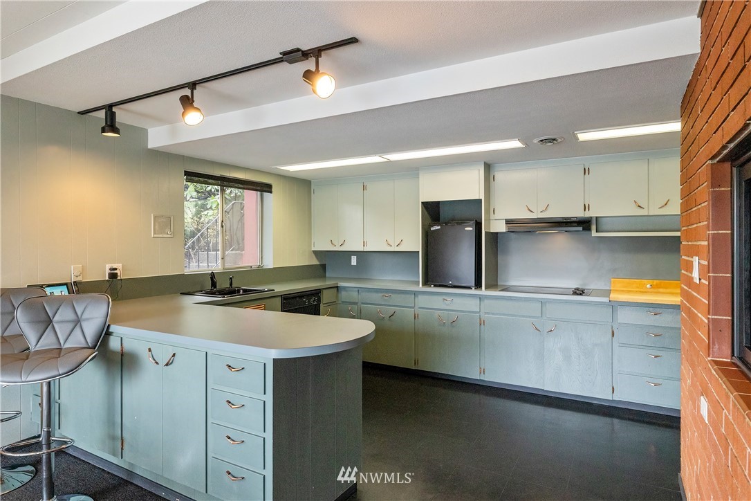 1600 Madrona Point Bremerton, WA 98312 - Photo 26 of 40 a kitchen with a sink cabinets and window