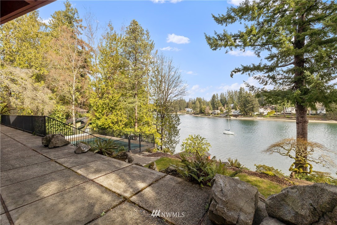 1600 Madrona Point Bremerton, WA 98312 - Photo 32 of 40 a view of a lake with couches and wooden floor