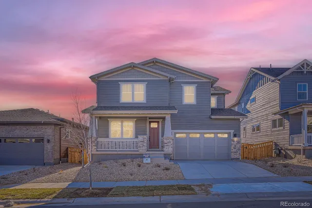a front view of a house with yard