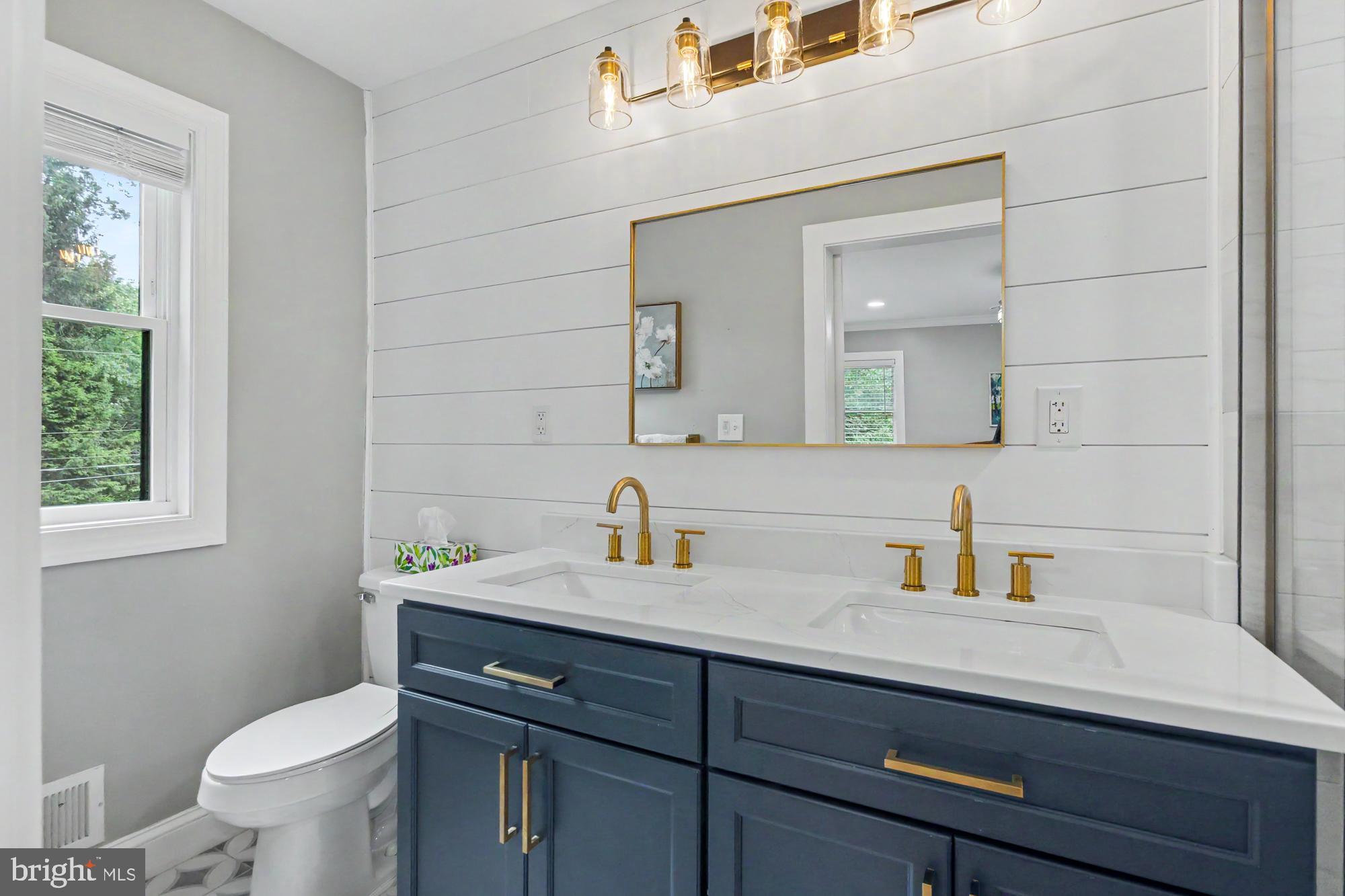 218 Felton Road Lutherville-Timonium, MD 21093 - Photo 26 of 55 statement lighting and navy and gold finishes