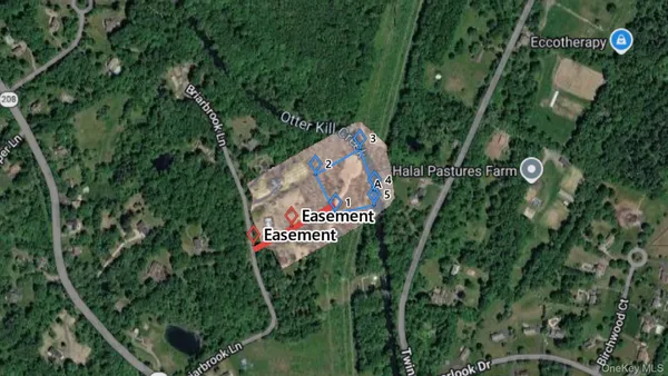 a sign that is sitting in a forest