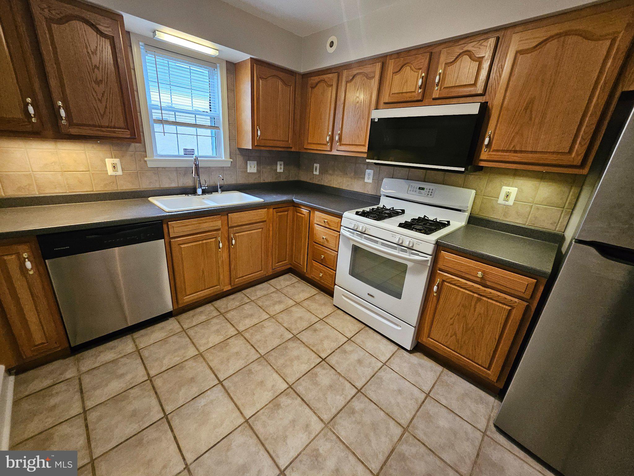 6 Arthur Road, Unit FRONT Rosemont, PA 19010 - Photo 6 of 24 Cozy kitchen with modern finishes.