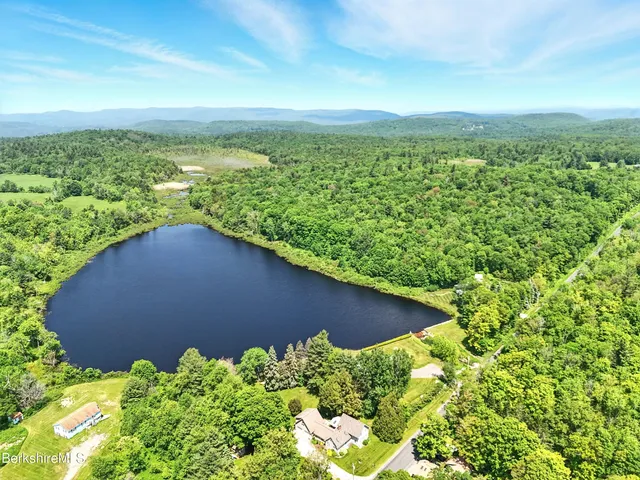 a view of a garden with an ocean view