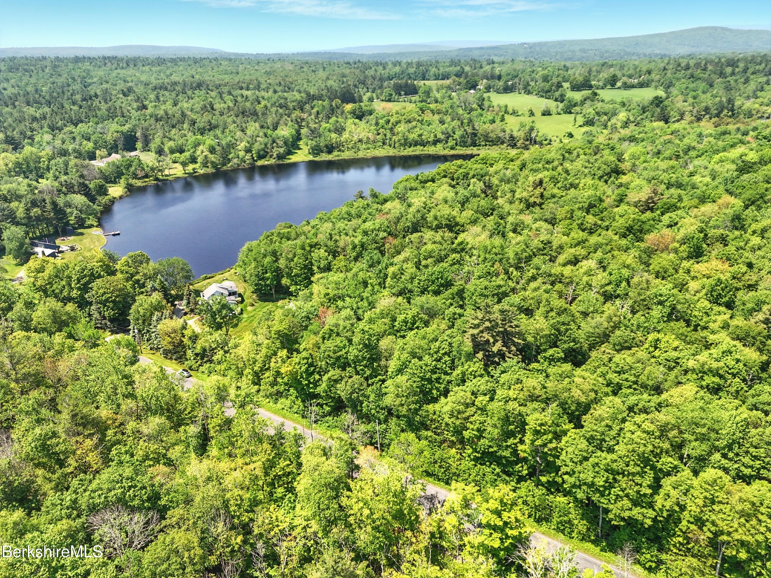 0 West Street Sandisfield, MA 01255 - Photo 14 of 16 an aerial view of residential houses with outdoor space and trees