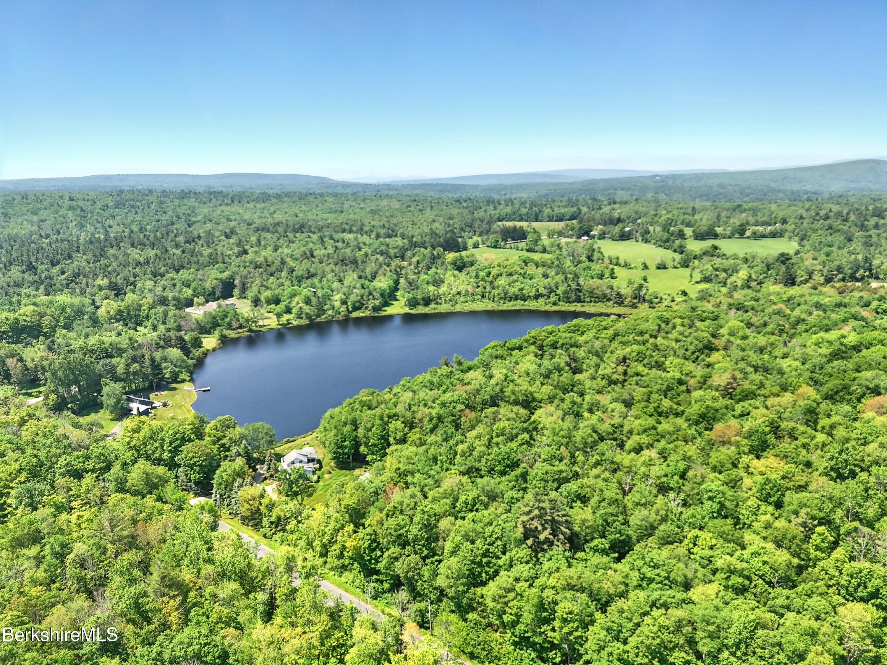 0 West Street Sandisfield, MA 01255 - Photo 4 of 16 an aerial view of a house with a yard and lake view