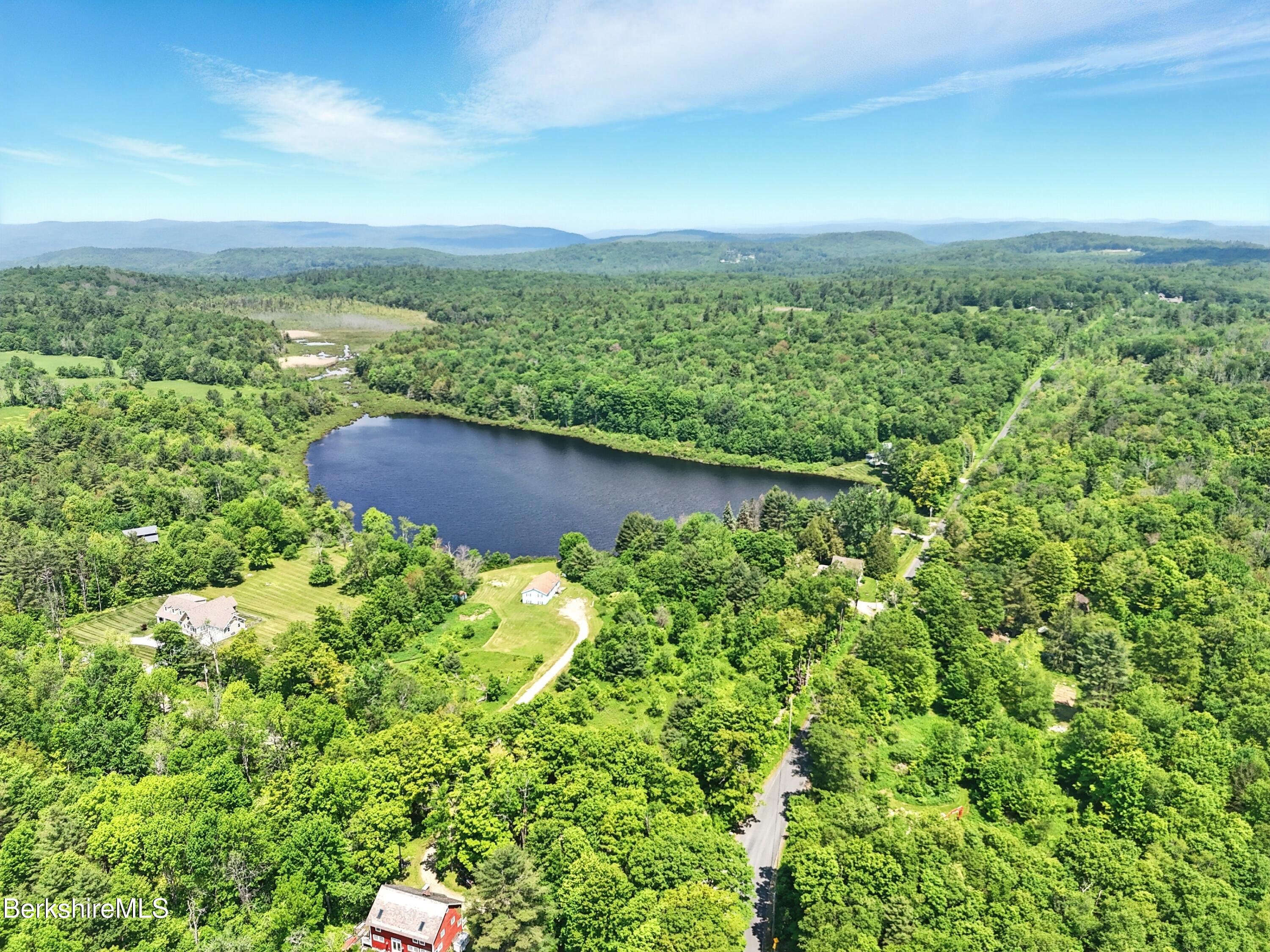 0 West Street Sandisfield, MA 01255 - Photo 8 of 16 an aerial view of residential houses with outdoor space and trees