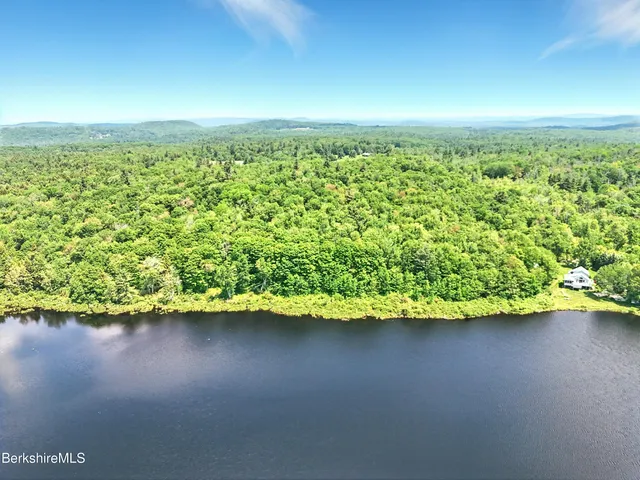 a view of a lake with a yard
