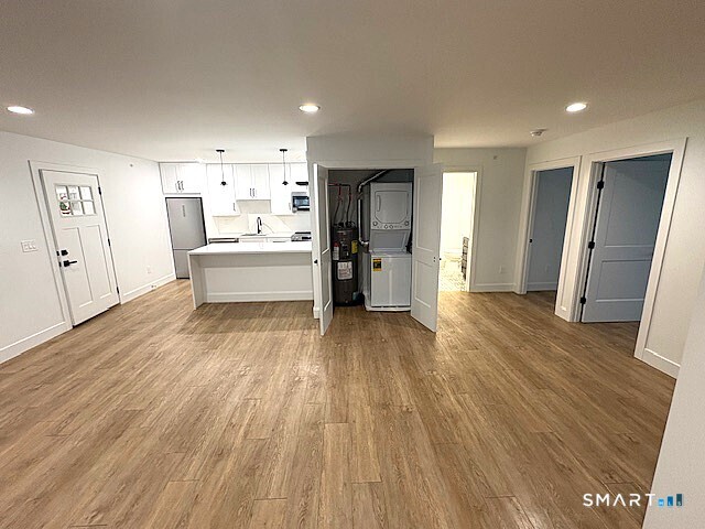 25 Church Street, Unit 301 New Milford, CT 06776 - Photo 5 of 14 a view of a living room and wooden floor