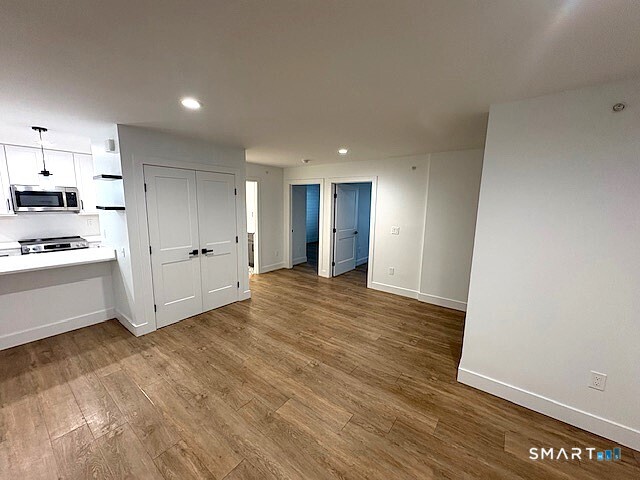 25 Church Street, Unit 301 New Milford, CT 06776 - Photo 6 of 14 a view of kitchen with wooden floor