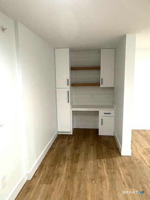 25 Church Street, Unit 301 New Milford, CT 06776 - Photo 7 of 14 a view of room with wooden floor