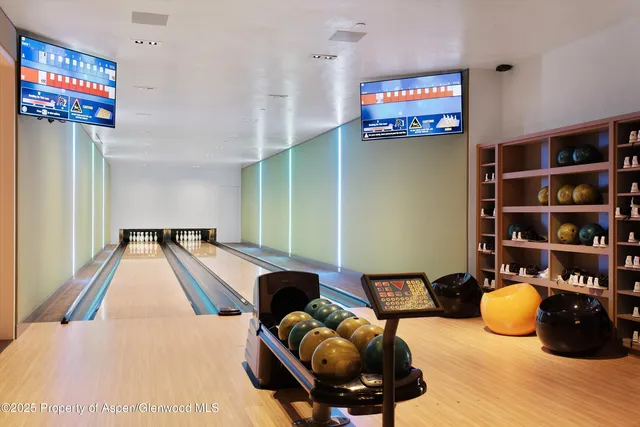 a media room with lots of chairs and a projector