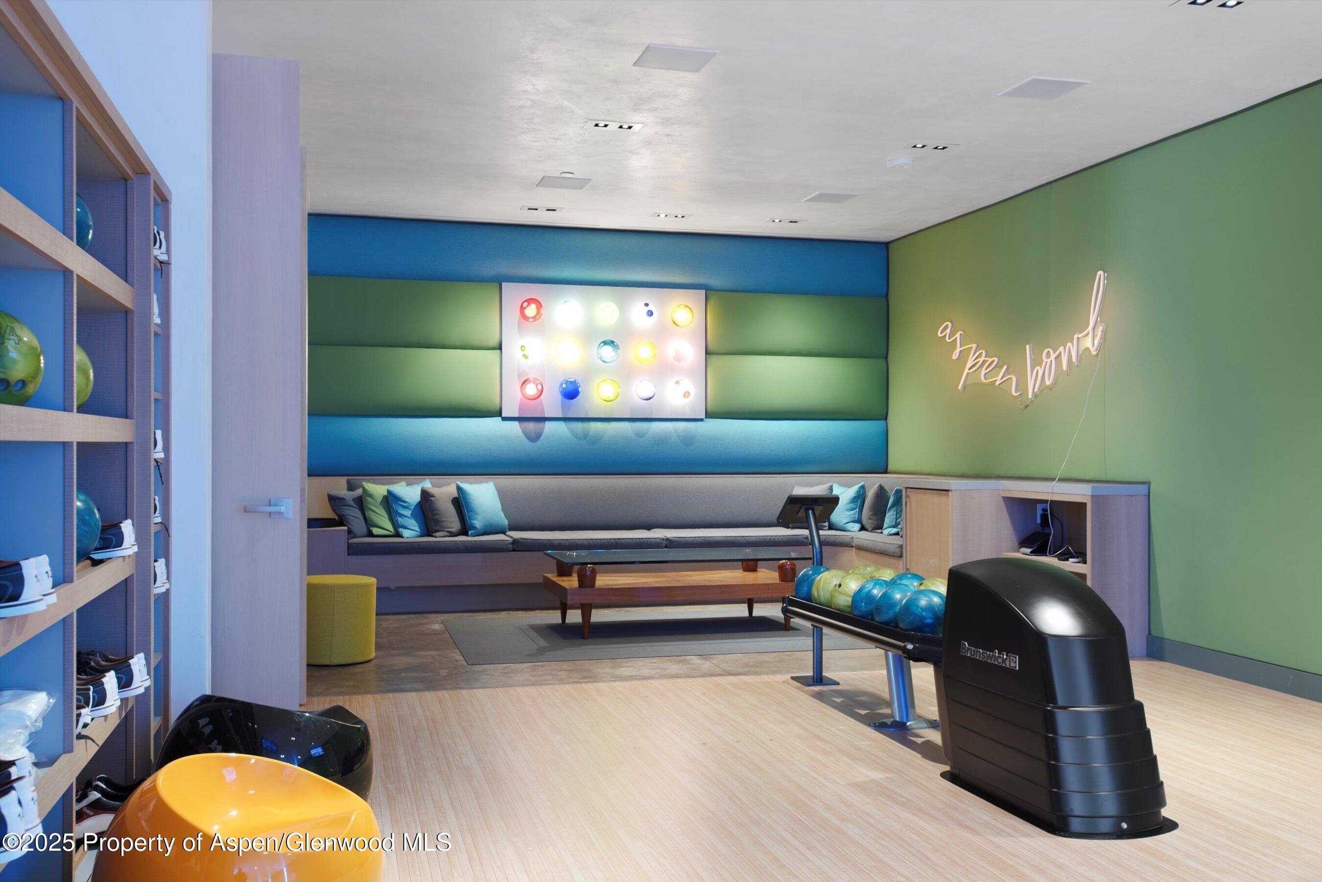 276 Coach Road Aspen, CO 81611 - Photo 27 of 54 a living room with furniture and a flat screen tv