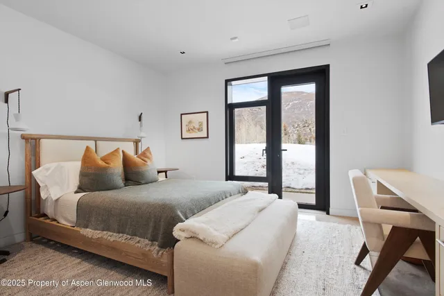 a bed room with a bed and a couch