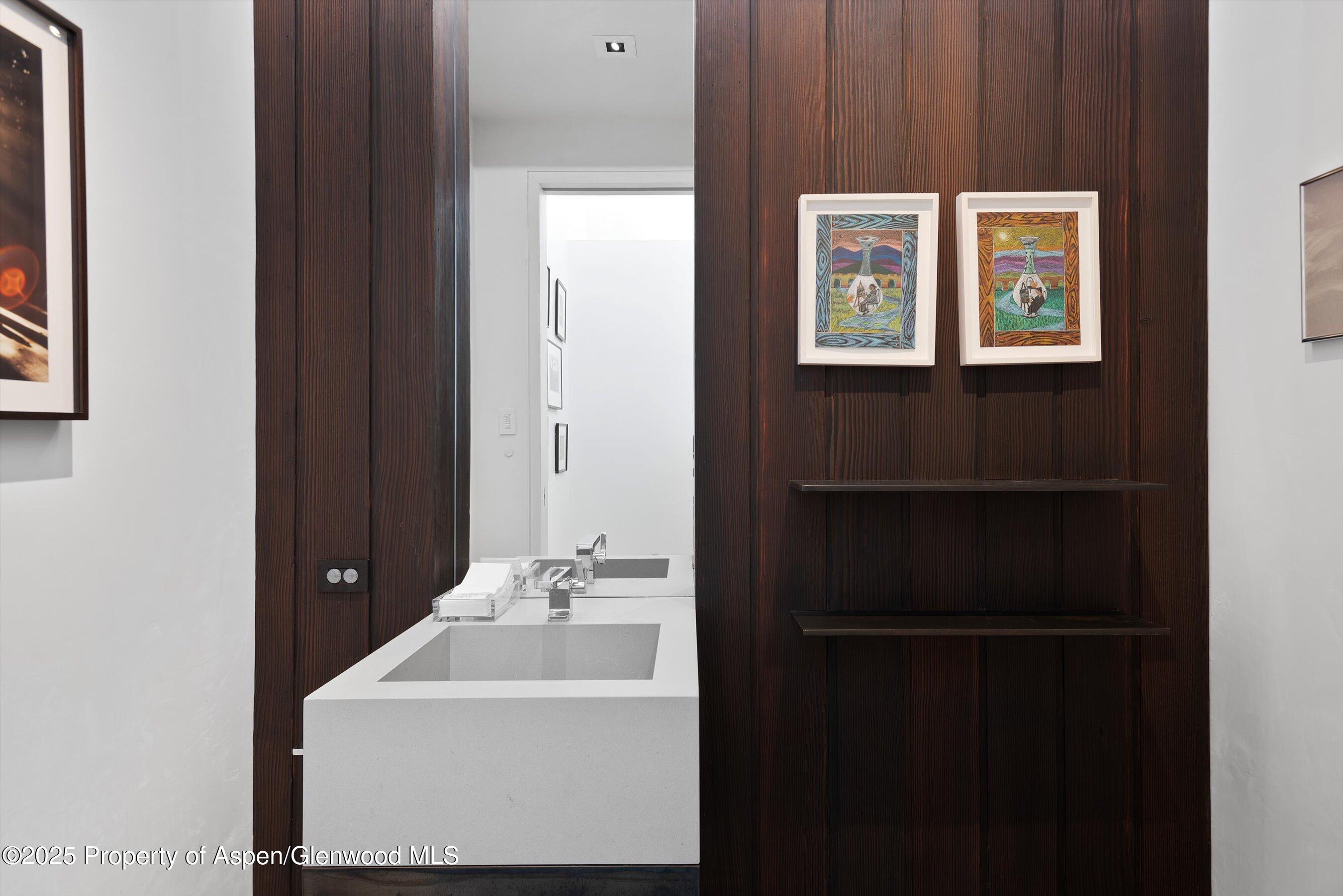 276 Coach Road Aspen, CO 81611 - Photo 41 of 54 a bathroom with a sink and a mirror